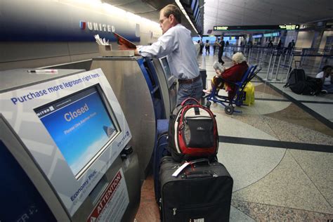 united mileageplus free checked bag.